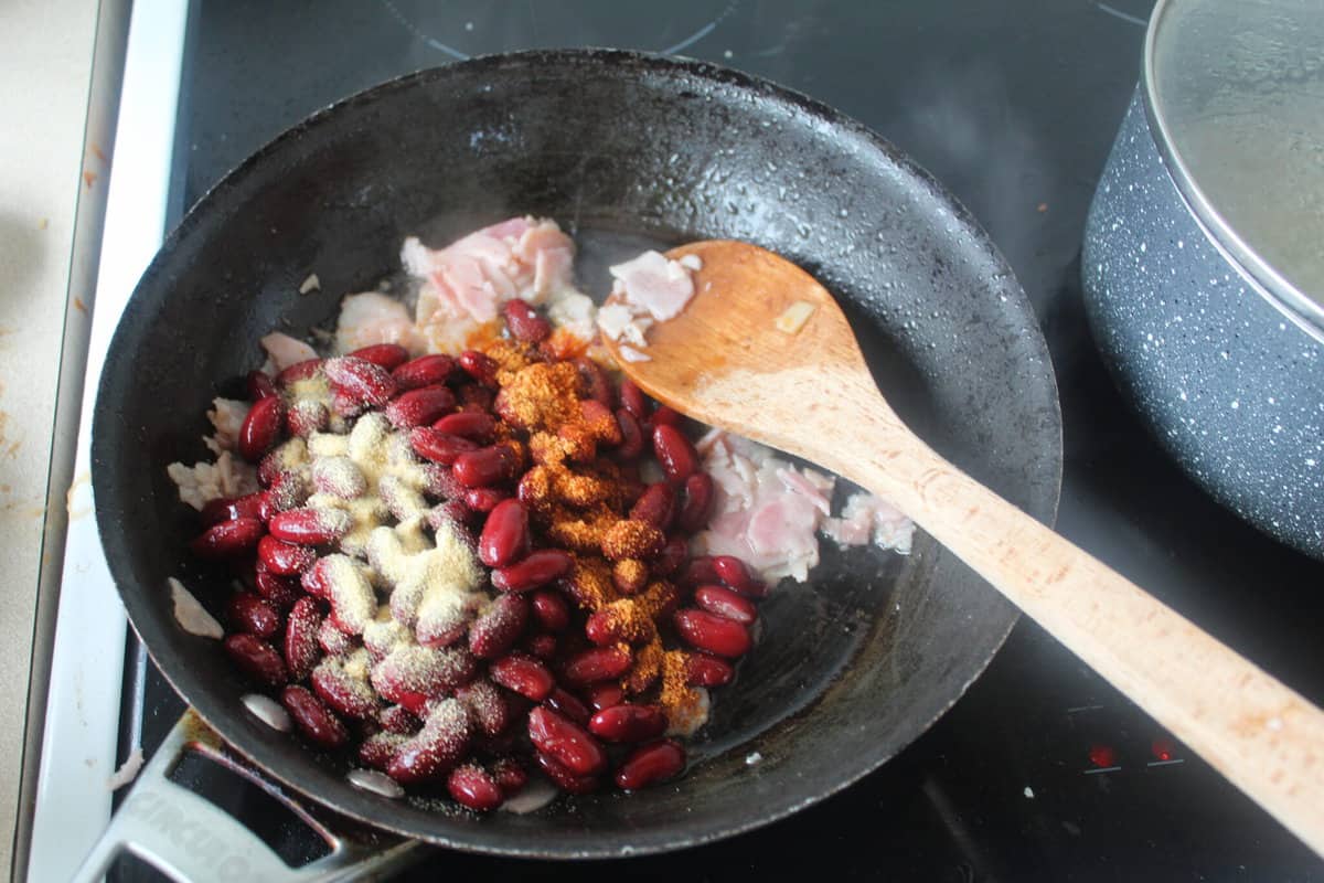 read beans and rice ingredients cooking in pan
