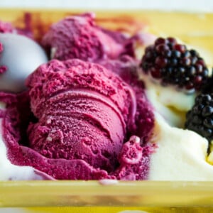 Lemon and black mulberry ice cream in plastic box