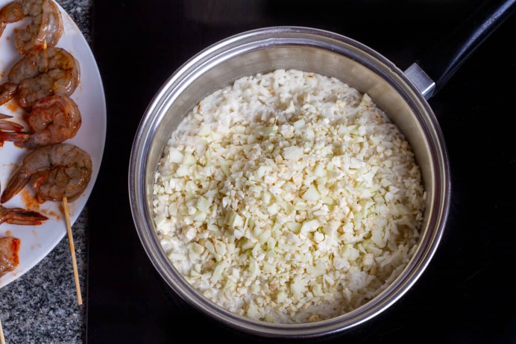 preparing cauliflower rice on stovetop