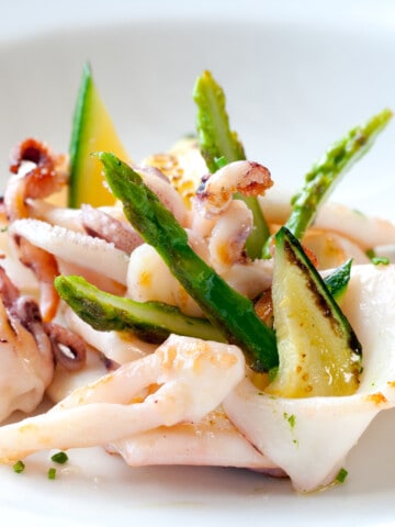 grilled calamari with asparagus on a plate