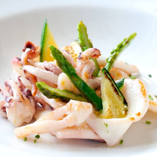 grilled calamari with asparagus on a plate