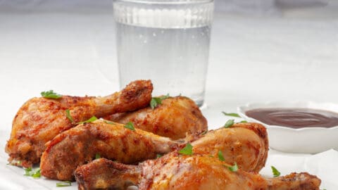 Crispy Air Fryer Chicken with fresh herb garnish.