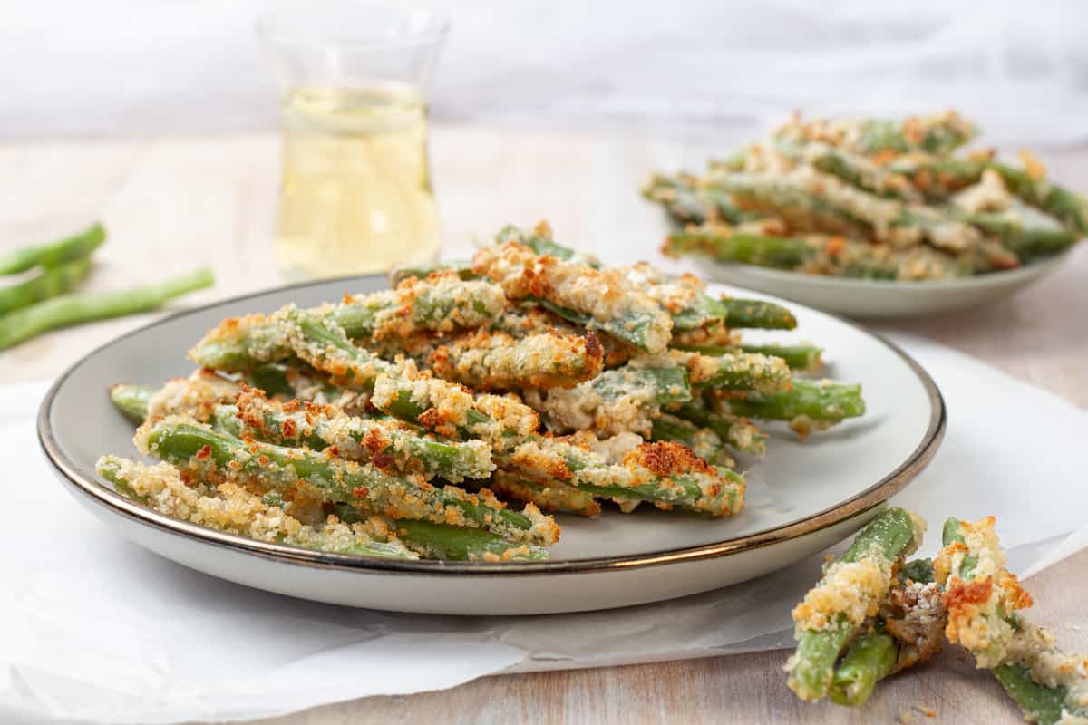 Crispy green bean fries on a platter.