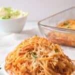 Chicken parmesan spaghetti bake on white plate