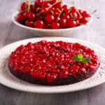 sour cherry chocolate upside down cake on a plate