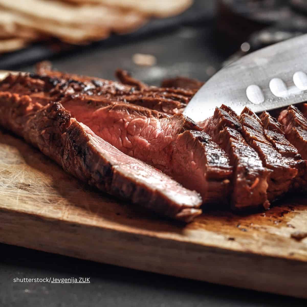 Flank steak on cutting board