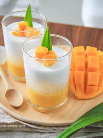 taro pearls with mango pudding in a dessert glass on a wooden serving platter
