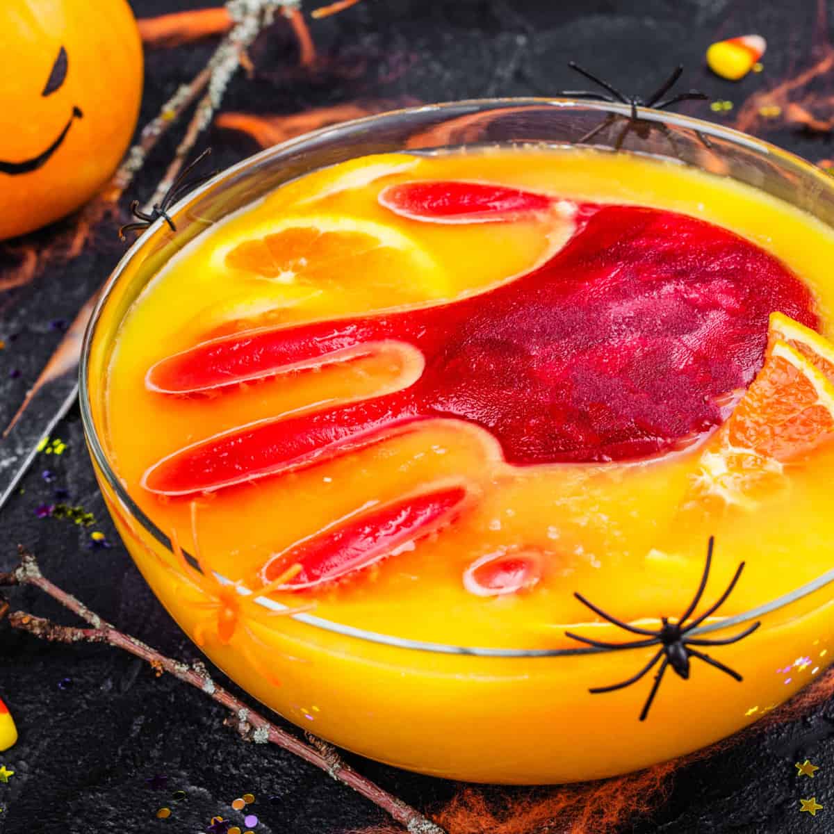 Scary halloween punch with red hand print in orange punch