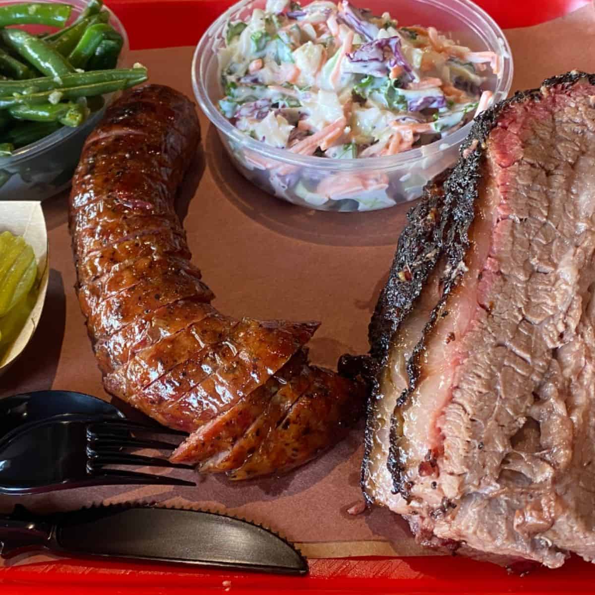 Sausage and Brisket with vegetable sides from Terry Black's BBQ in Austin. 