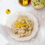 Shredded Mississippi Chicken garnished with yellow pepper.