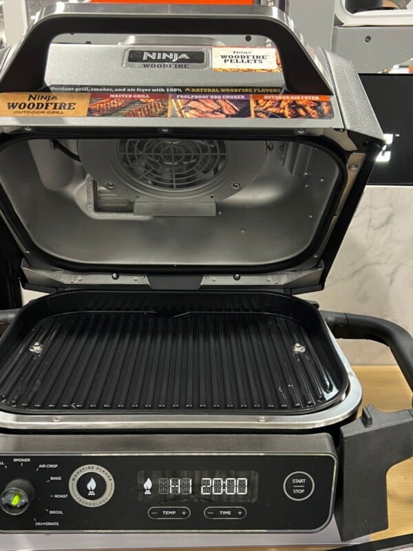 ninja woodfire grill with top up showing the grilling surface