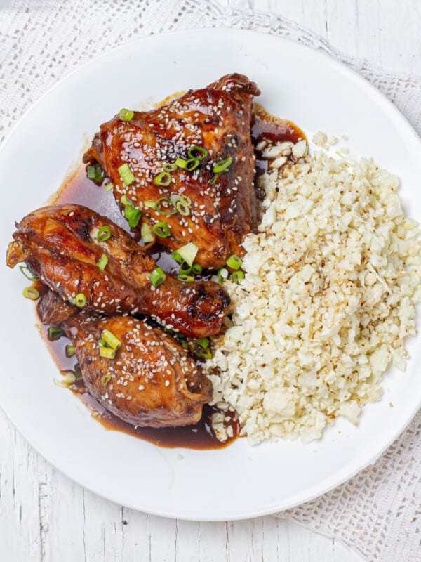 Sweet and sour Shoyu chicken and rice on a plate.