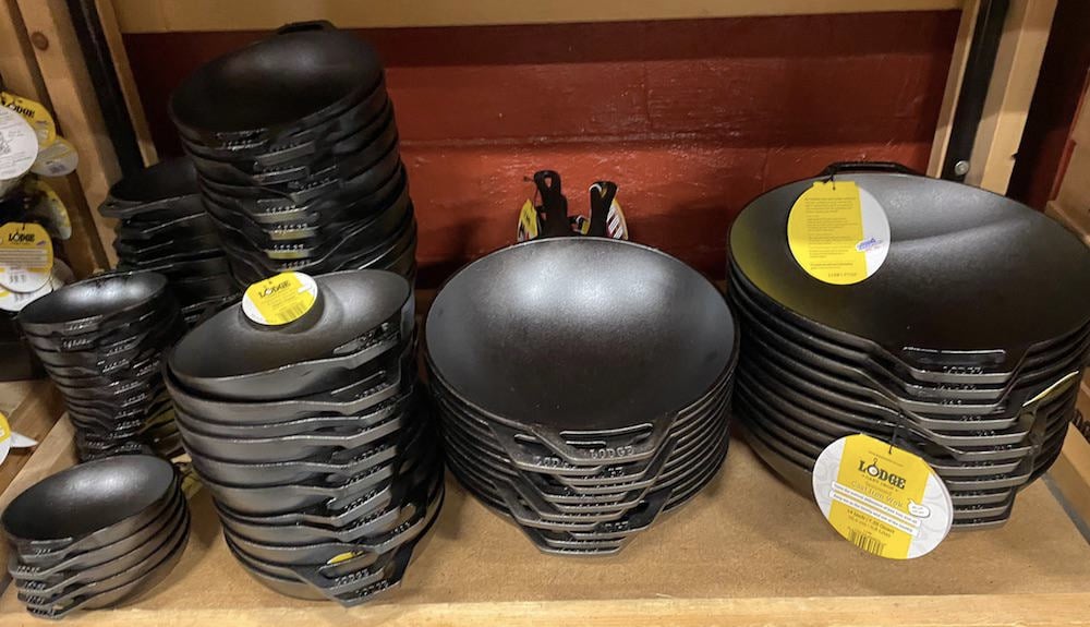 stack of lodge cast iron woks