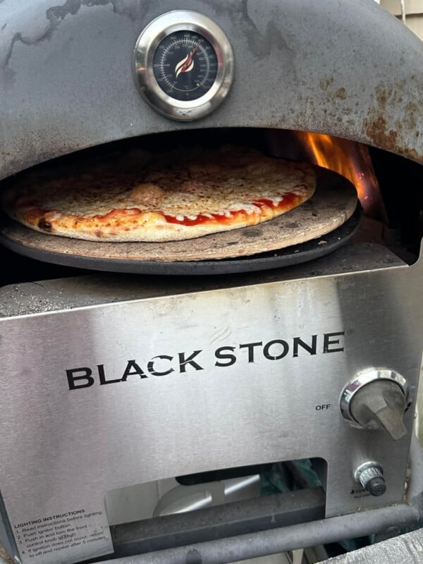 blackstone pizza oven cooking a pizza