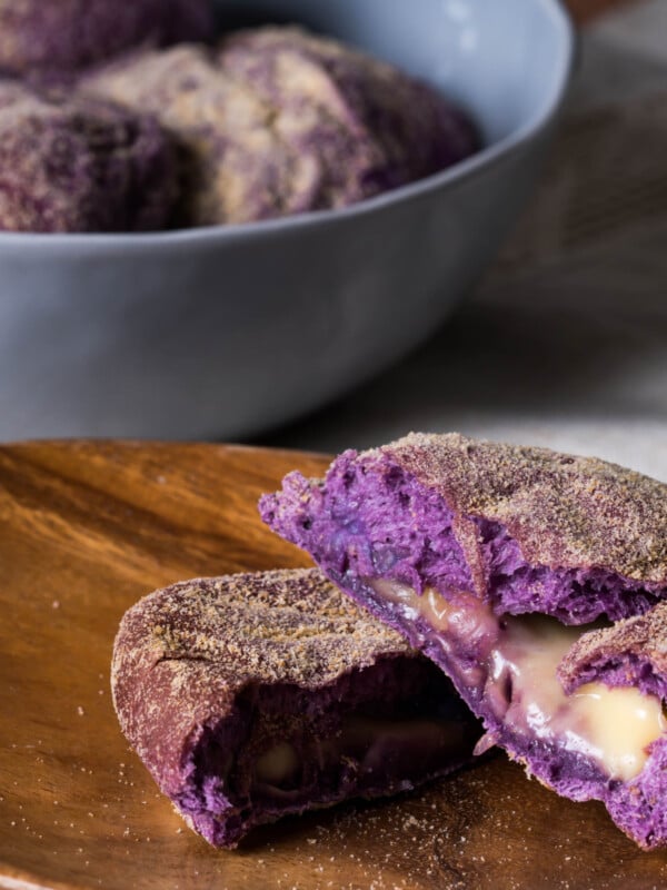 ube cheese pandesal on a cutting board