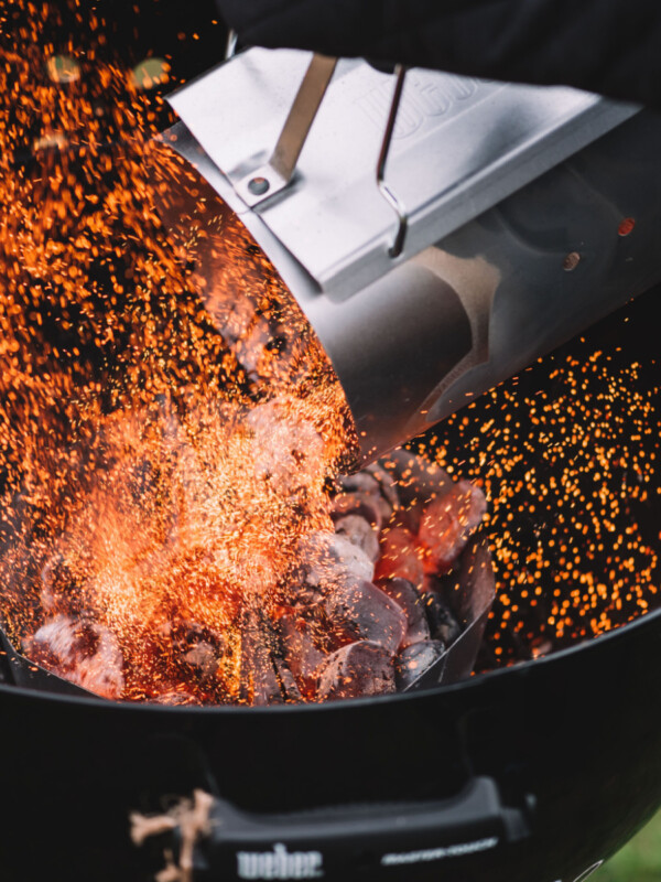 hot coals being dumped into weber grill