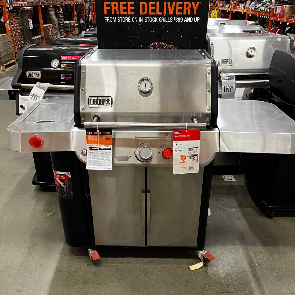 weber stainless steel gas grill on display