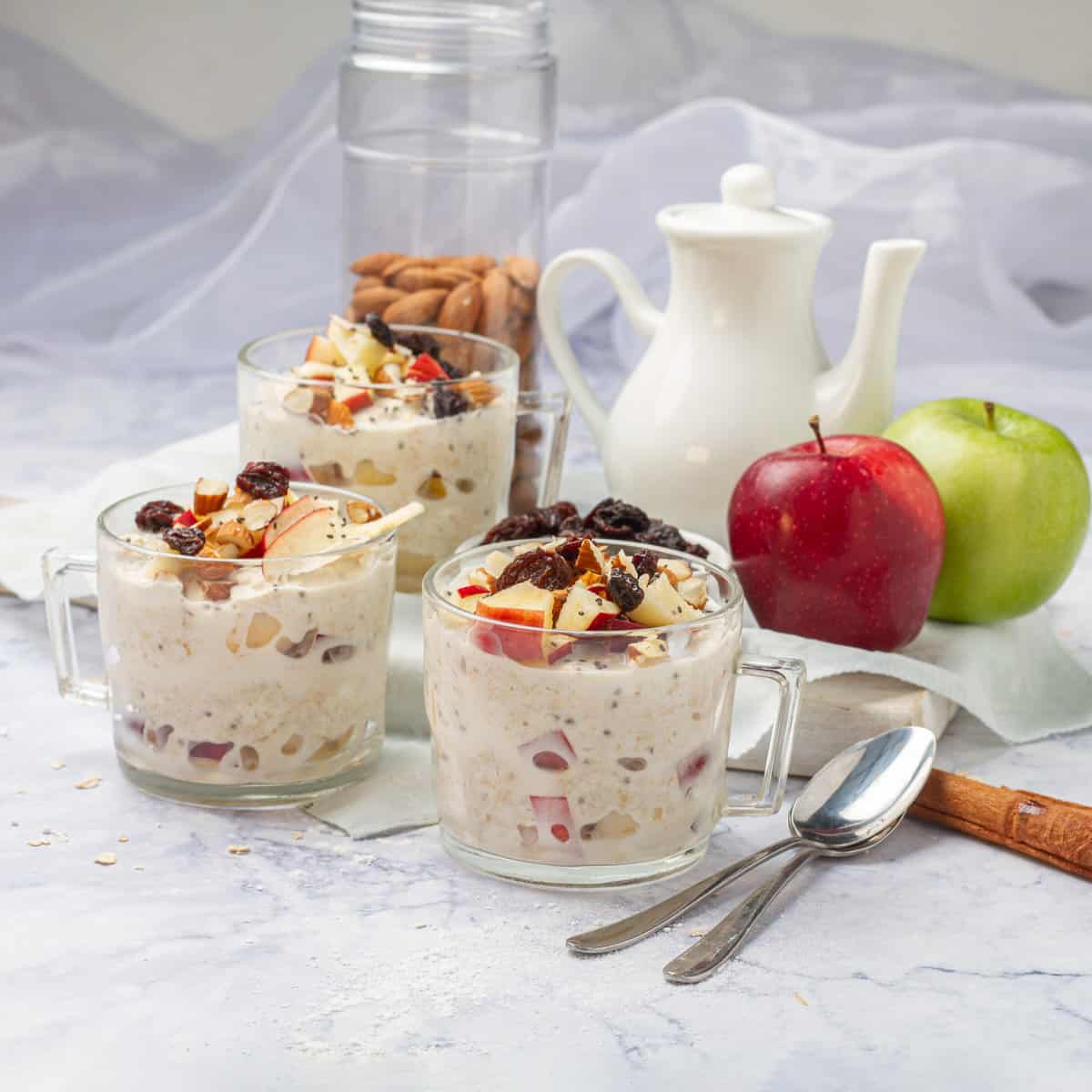 Creamy and nutritious apple overnight oats with fresh fruit and nuts.