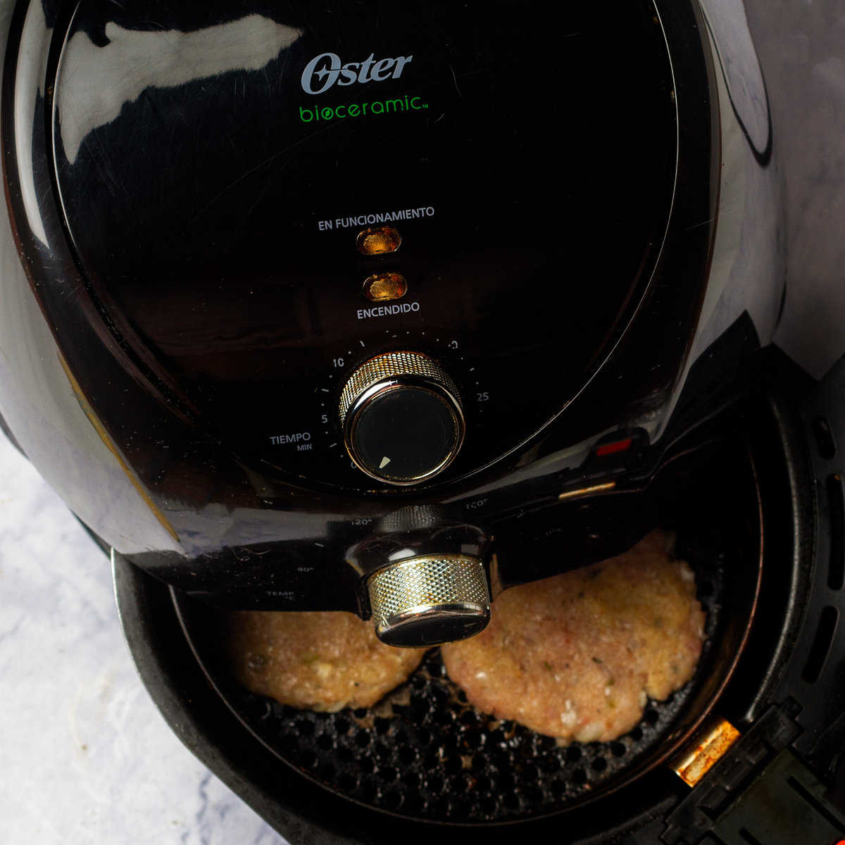 Cooking the turkey burger patties in an air fryer.