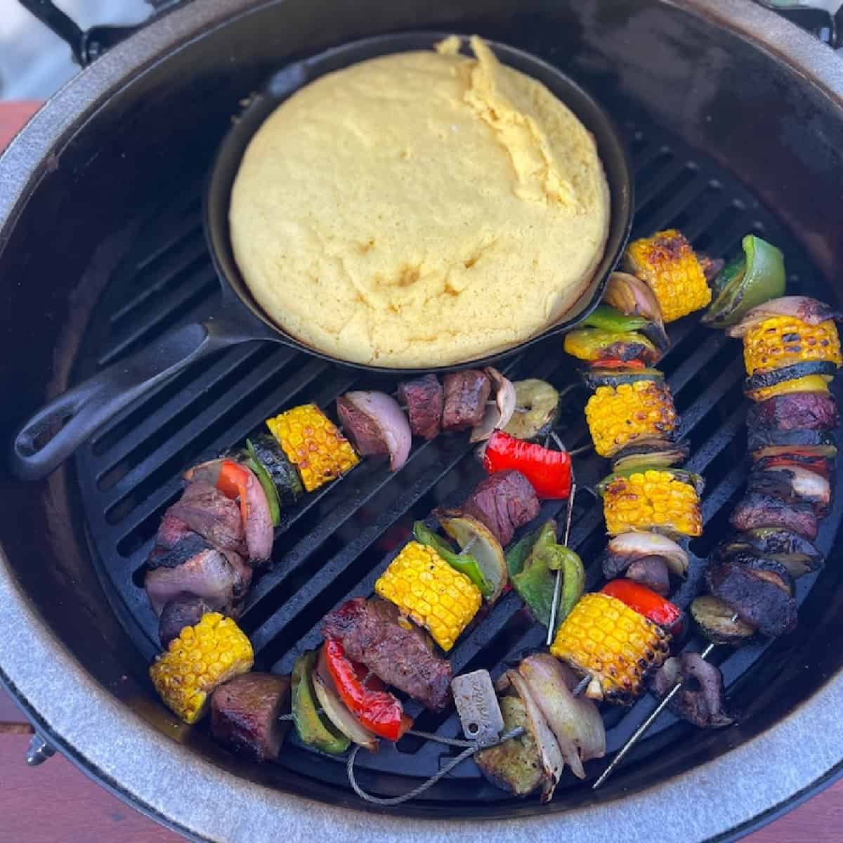 steak kabobs cooking on a big green egg