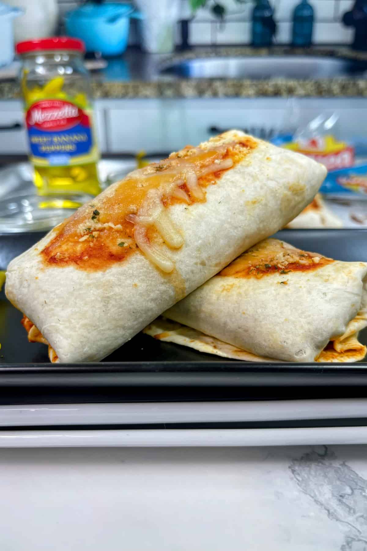 two pizza burritos on a plate