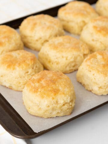 baked sour milk biscuits on a pan
