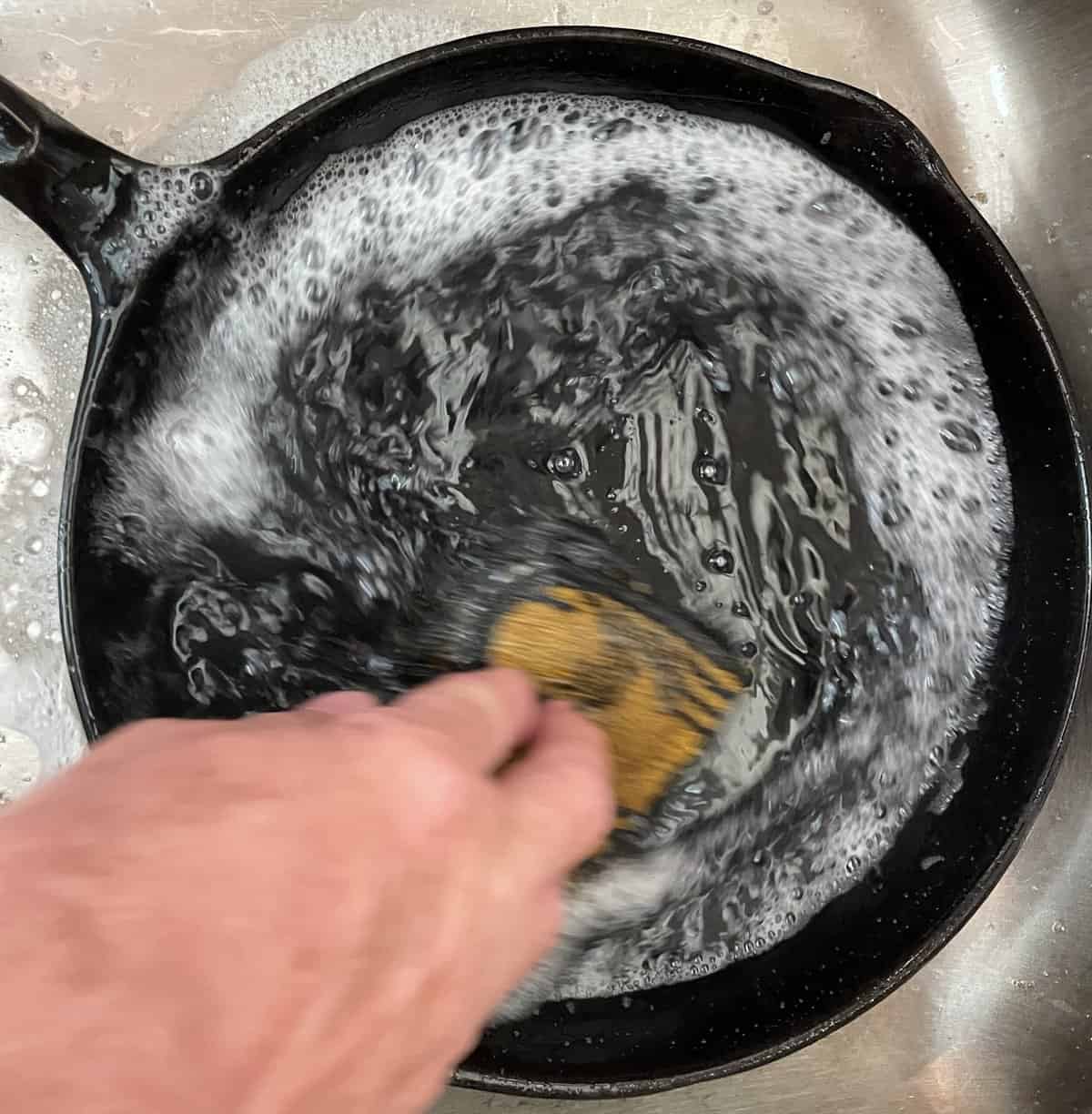 washing cast iron in sink