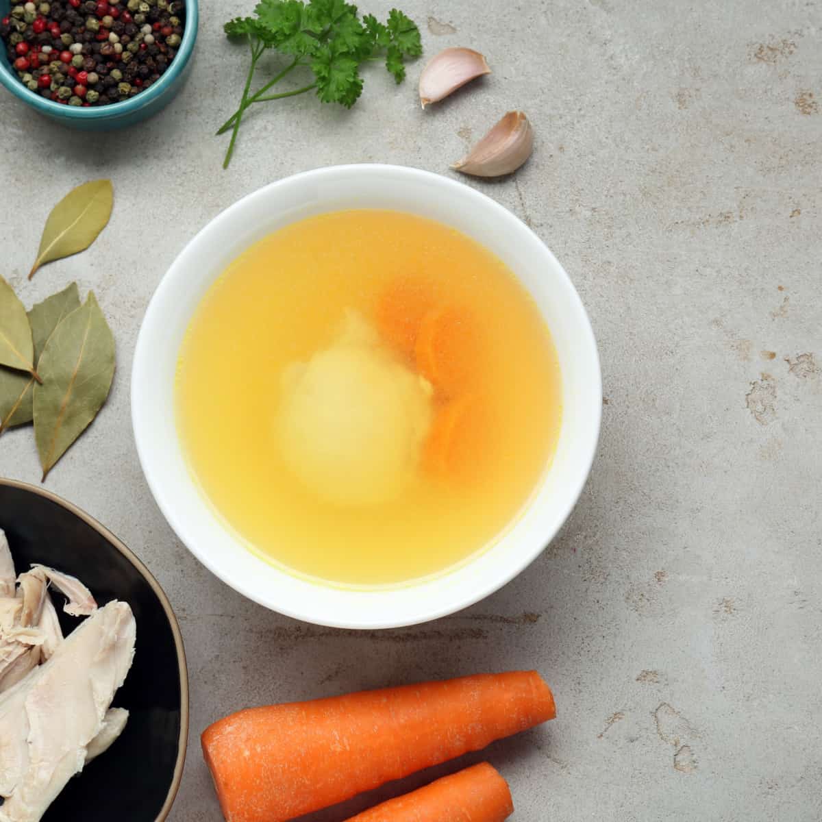 chicken bouillon in white bowl