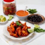Chicken al Pastor served with cilantro topping and lemon slice