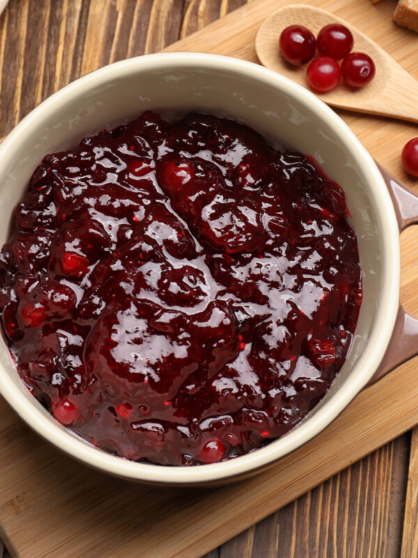 cranberry sauce on wooden cutting board
