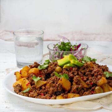 Cuban Picadillo served with salad and dressing of Avocados slices