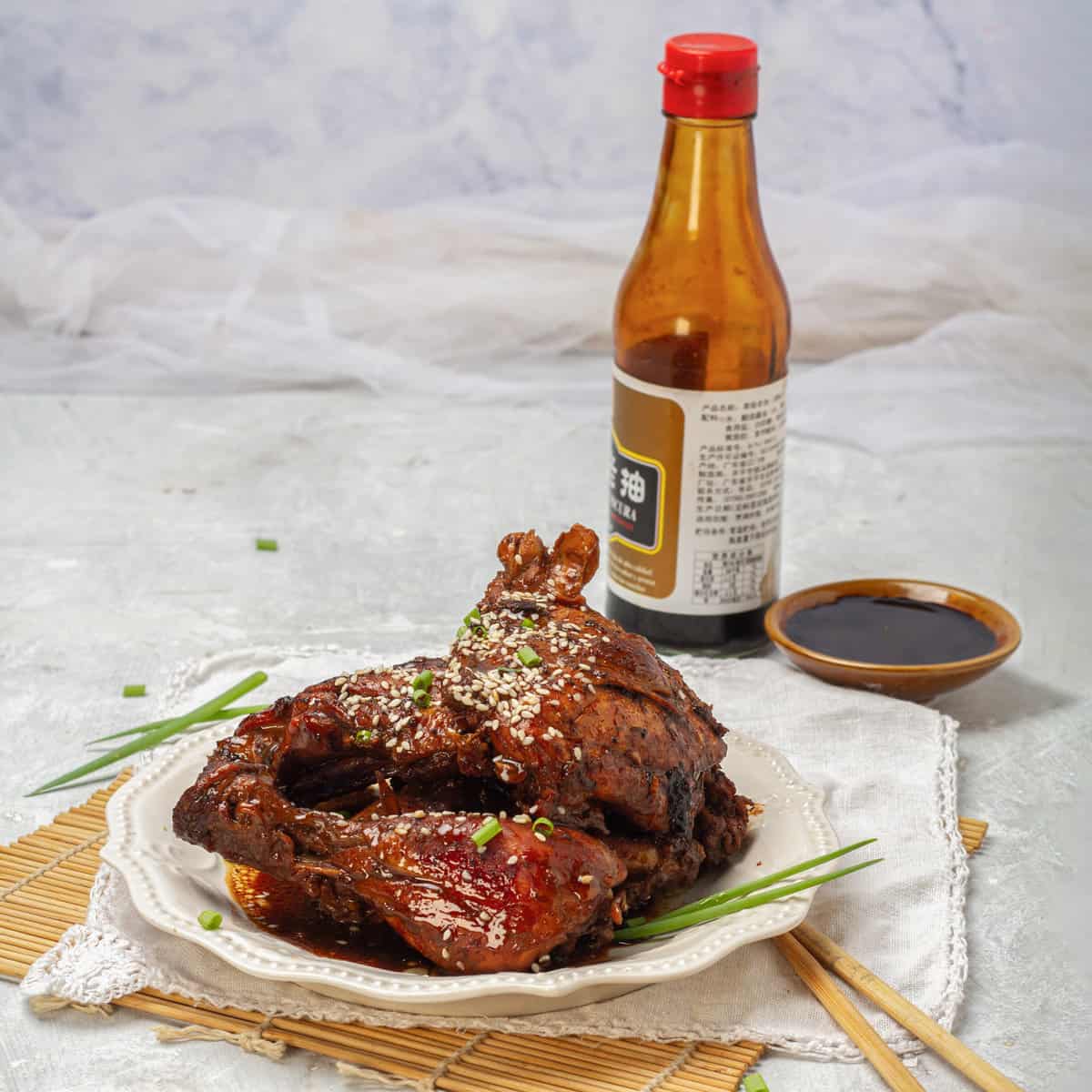 Filipino Chicken Adobo served with sauce and wine