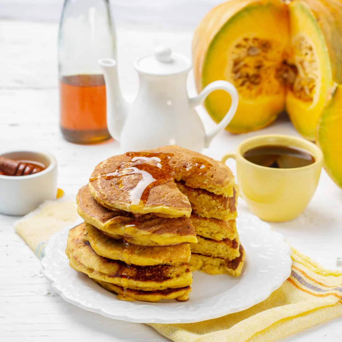 Honey flowing over Pumpkin Pancakes stack