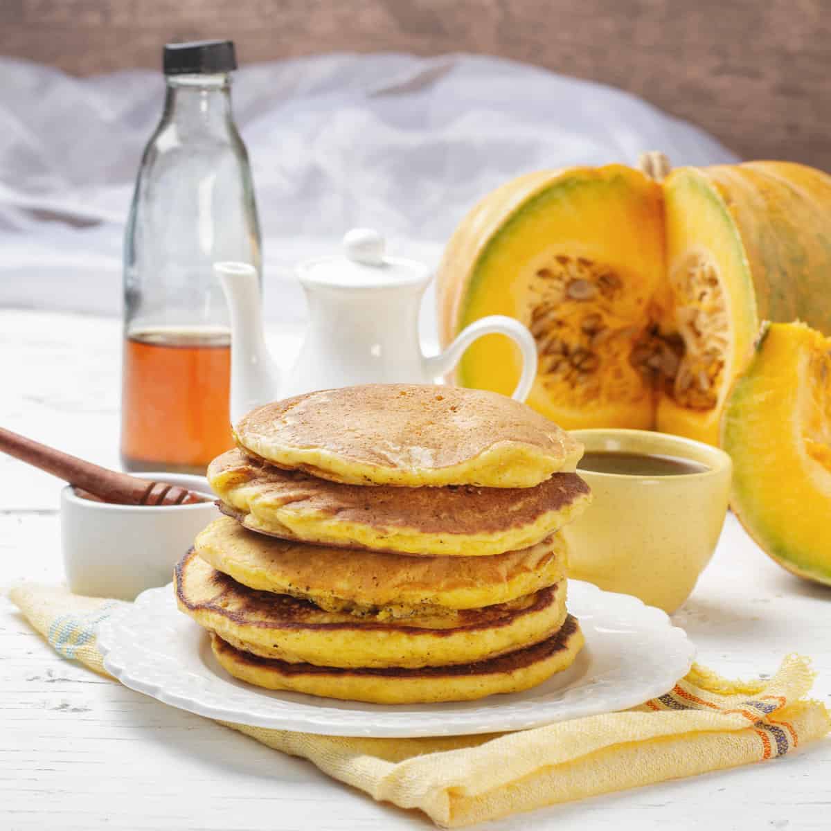 Pumpkin Pancakes stacked and served in plate
