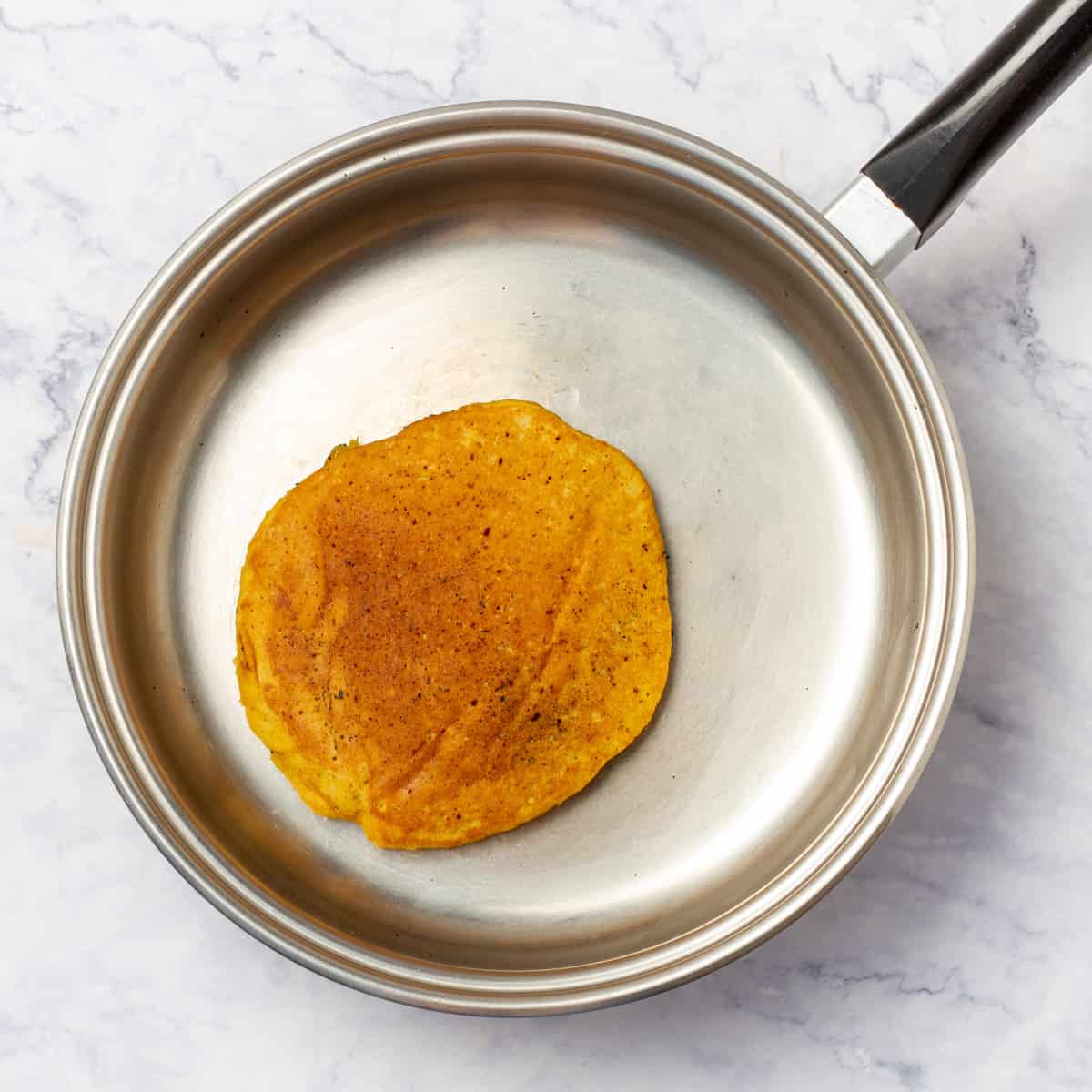 Pumpkin Pancake cooking in frying pan