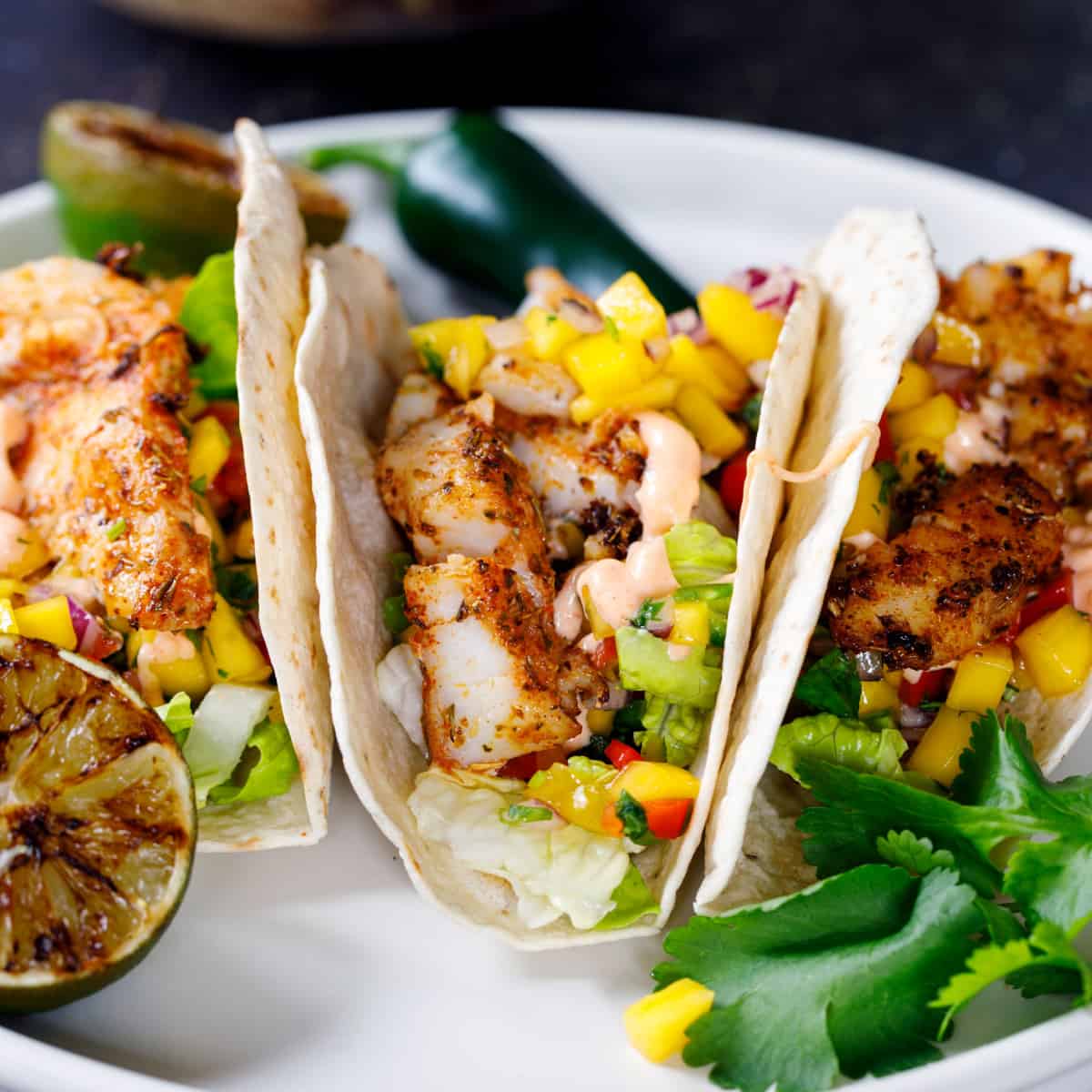 Fish tacos on white plate