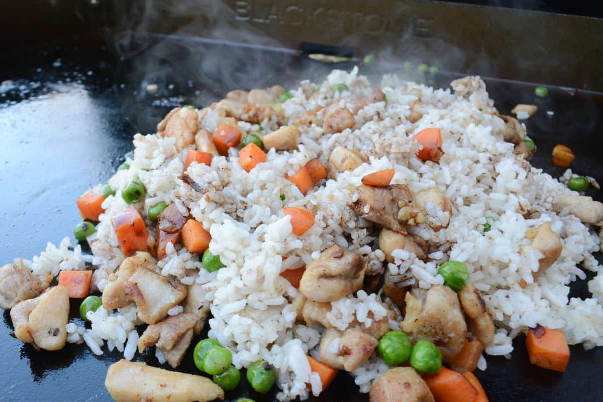 chicken fried rice cooking on blackstone