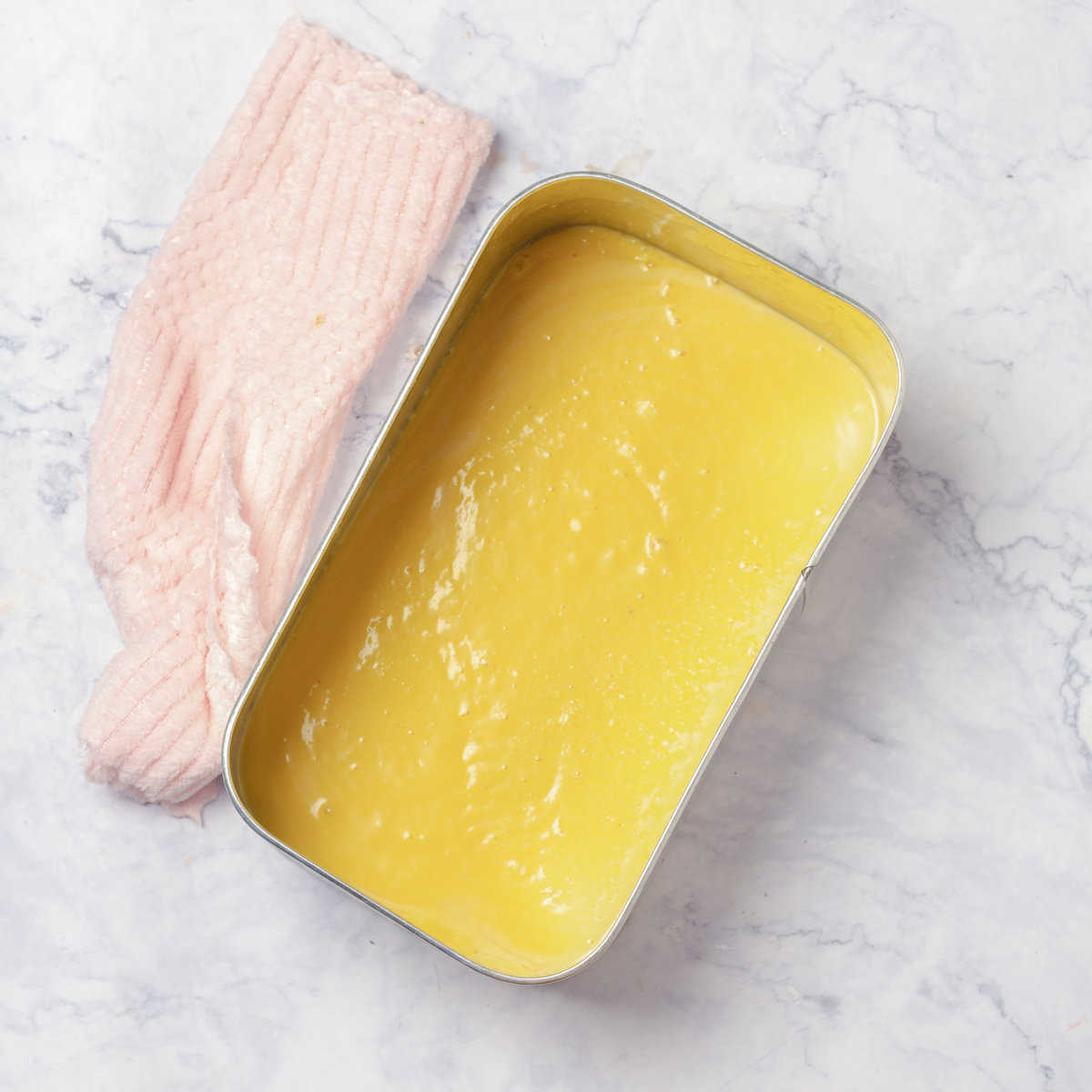Creamy Mango and Coconut Ice Cream mix in metal container
