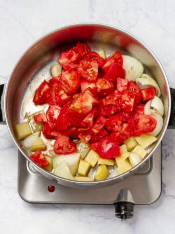 diced tomatoes and peeled potato added to cooked Onion and Garlic in sauce pan
