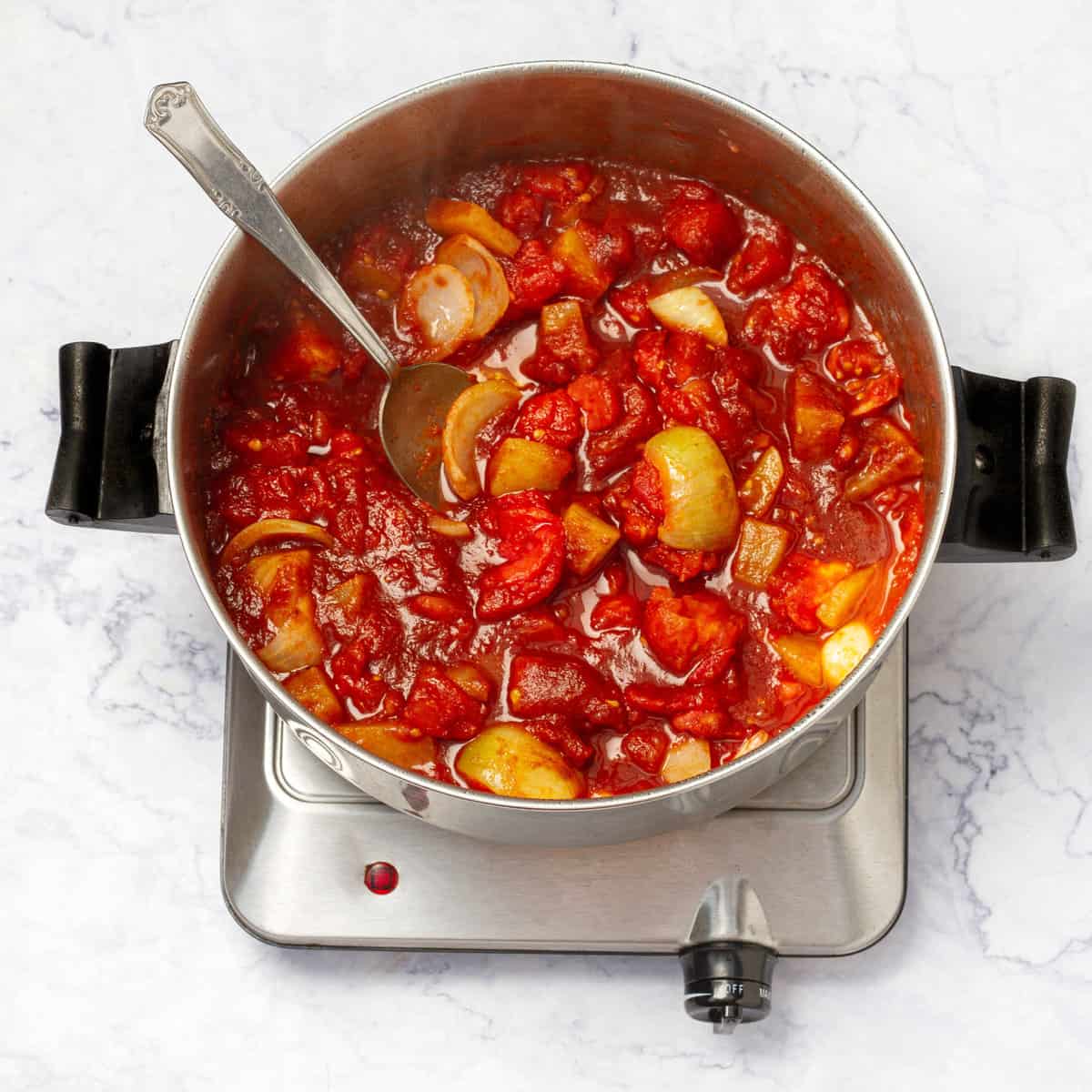 Cooking tomatoes in sauce pan