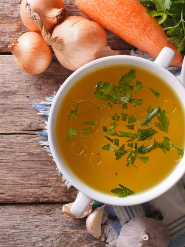 chicken broth in white bowl