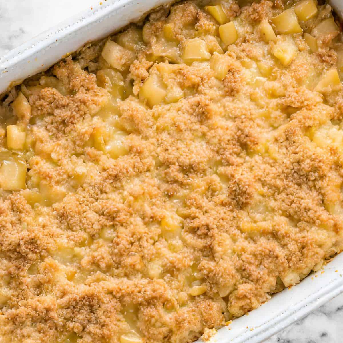 pineapple casserole in white casserole dish fresh out of the oven