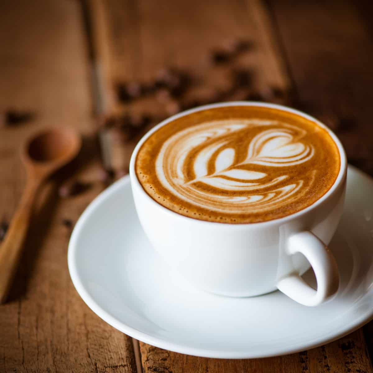 latte with flower design using steamed milk
