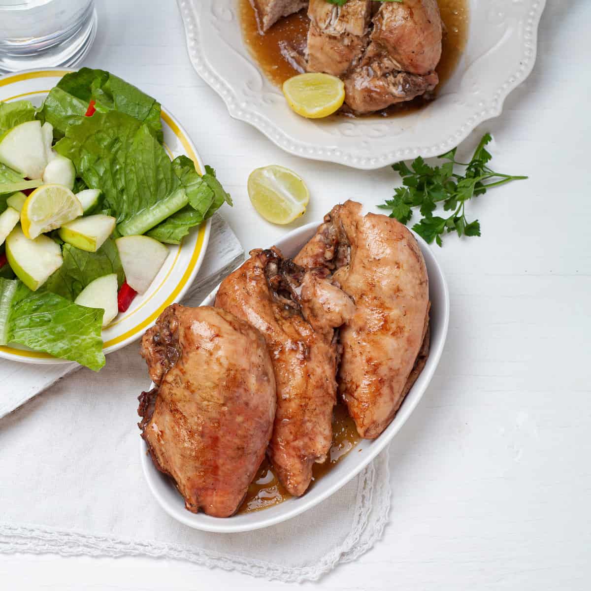 Apple Balsamic Chicken served on table with salad