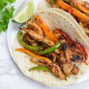 blackstone chicken fajitas on white plate