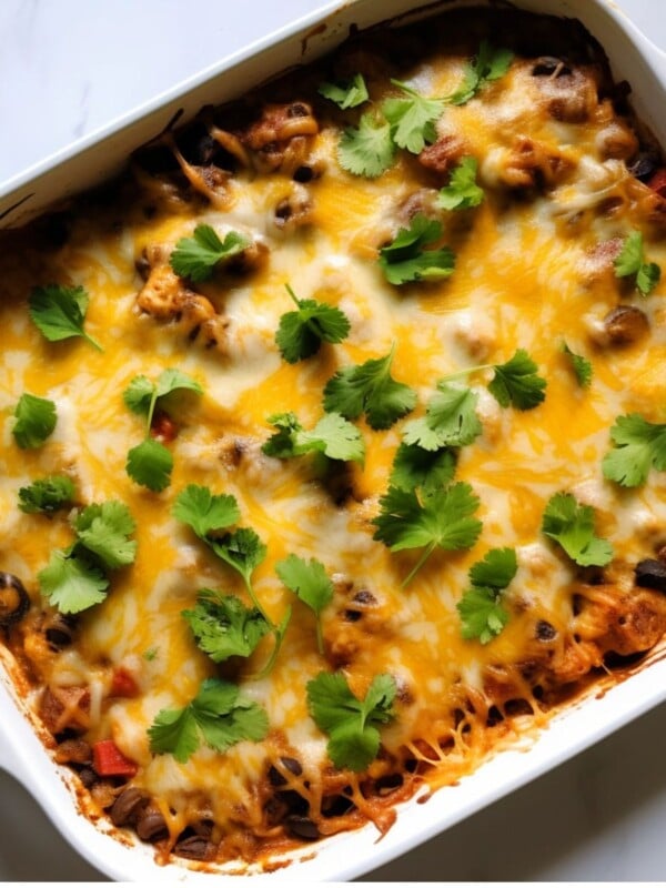 Mexican casserole in white baking dish fresh out of the oven