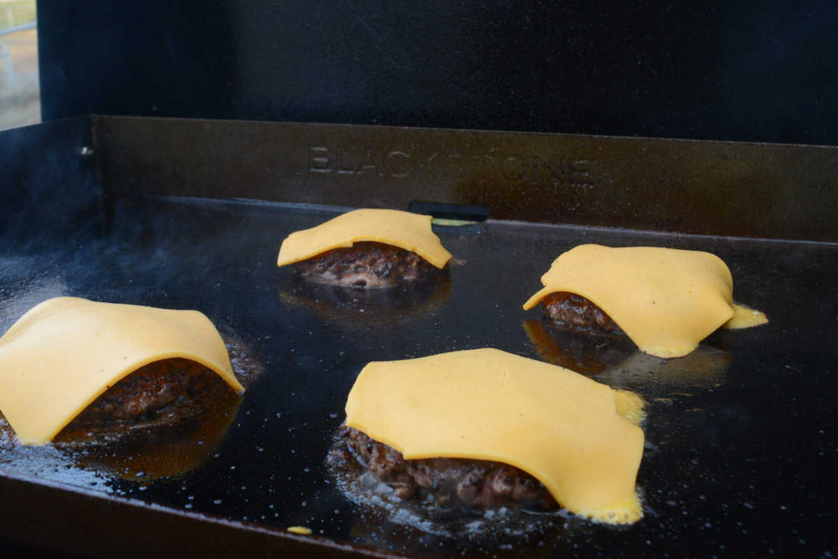 blackstone smash burgers topped with cheese