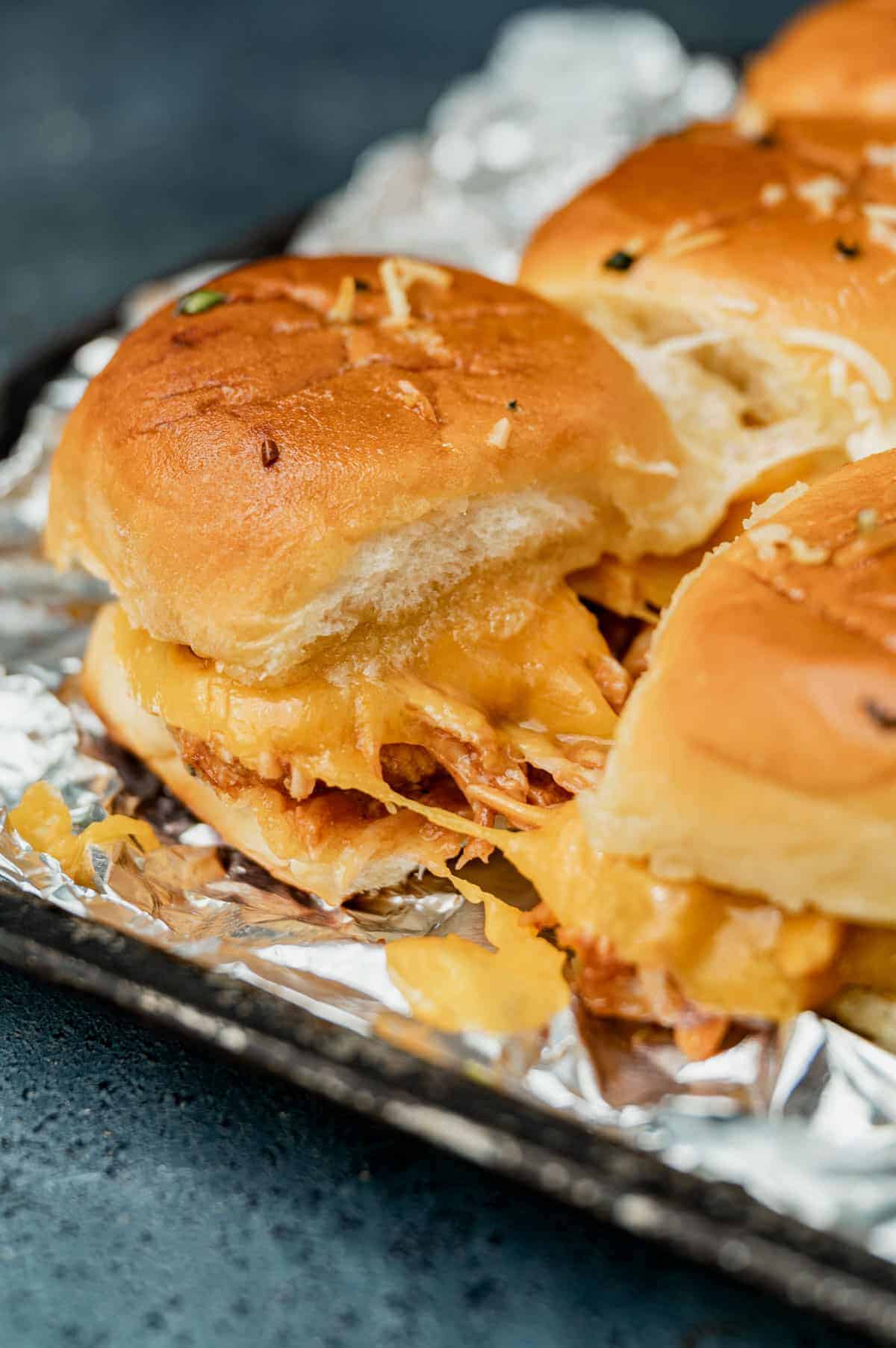BBQ chicken sliders on a tray.