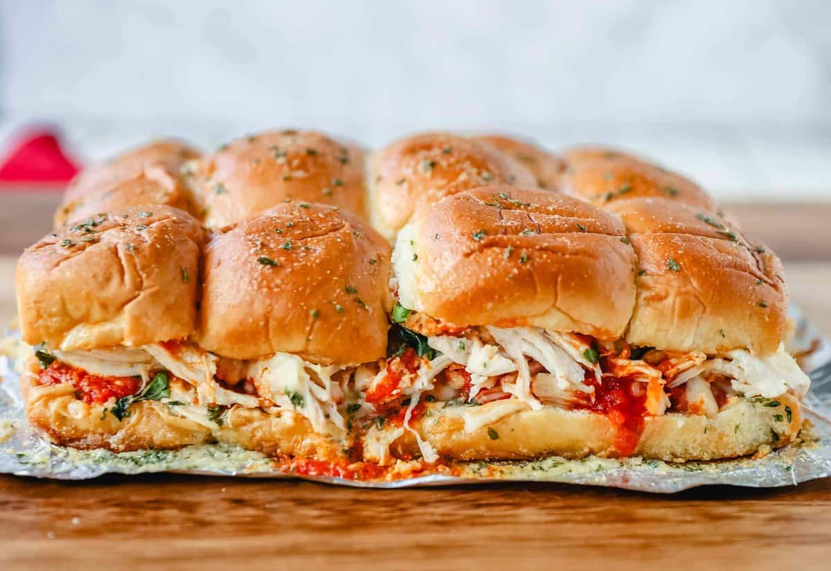 A baked chicken parm slider on a table.