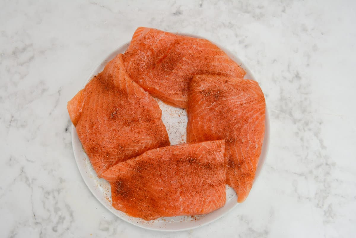 raw marinated salmon filets, sprinkled with dry spices